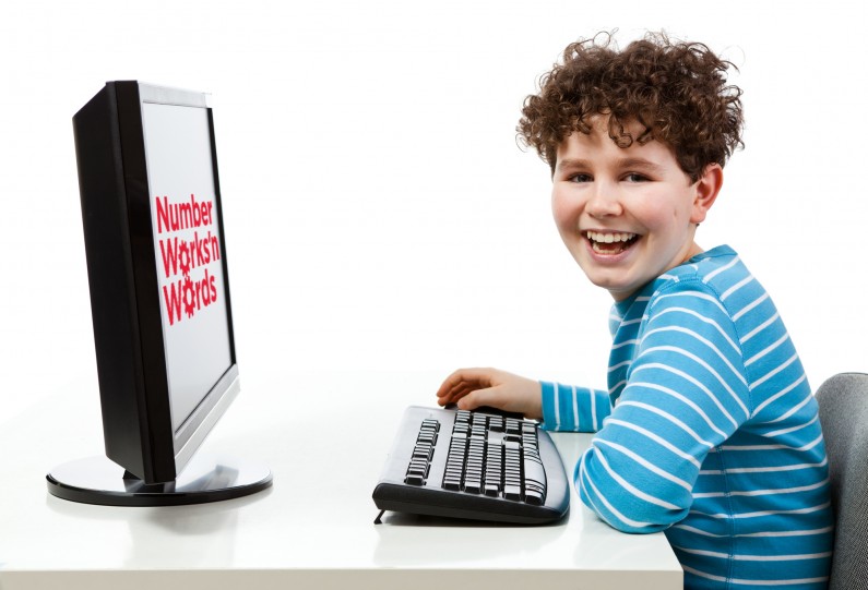 Boy at computer with logo